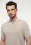 Knitted polo shirt in beige plain